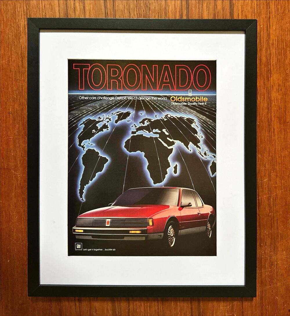Framed 1986 Print Ad Toronado Oldsmobile Challenge the World